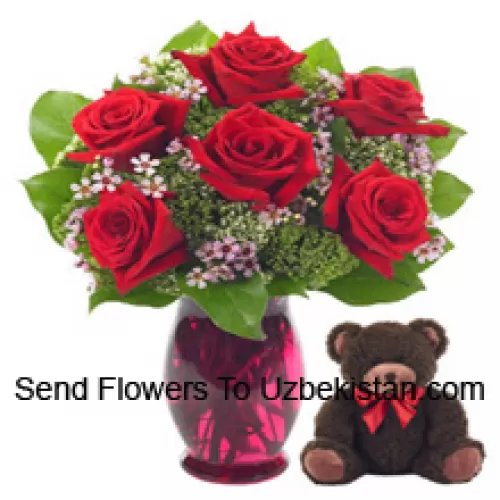 7 Red Roses With Some Ferns In A Glass Vase Along With A Cute 14 Inches Tall Teddy Bear