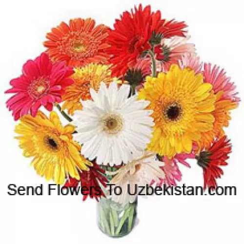 19 Mixed Colored Gerberas With Some Ferns In A Glass Vase