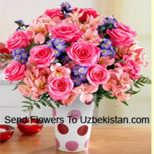 Pink Roses, Pink Orchids And Assorted Purple Flowers Arranged Beautifully In A Glass Vase