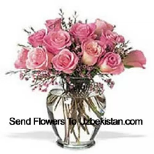 Bunch Of 11 Pink Roses With Some Ferns In A Vase