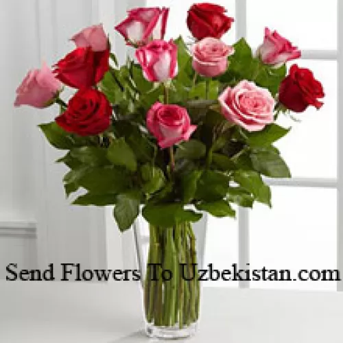 5 Red, 4 Pink And 4 Dual Toned Roses With Seasonal Fillers In A Glass Vase