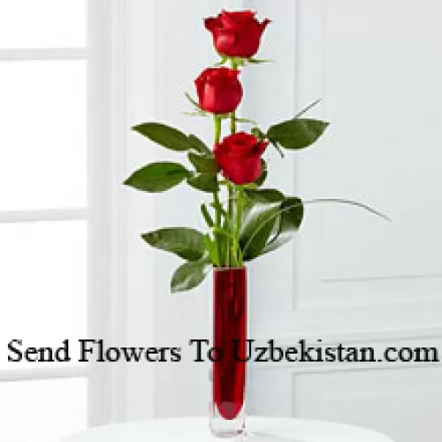 Three Red Roses In A Red Test Tube Vase (We Reserve The Right To Substitute The Vase In Case Of Non-Availability. Limited Stock)