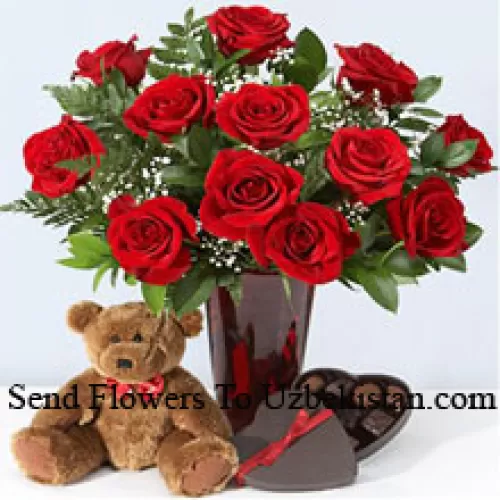 11 Red Roses With Some Ferns In A Vase, Cute Brown 10 Inches Teddy Bear And A Heart Shaped Chocolate Box.