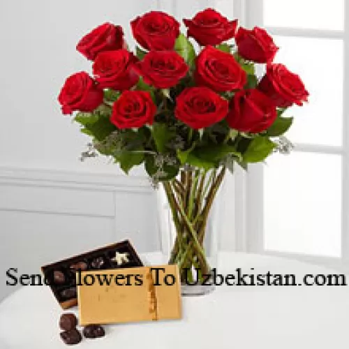 11 Red Roses With Some Ferns In A Vase And A Box Of Godiva Chocolates (We reserve the right to substitute the Godiva chocolates with chocolates of equal value in case of non-availability of the same. Limited Stock)