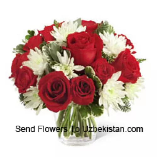 This Bouquet is a charming display of holiday beauty and winter warmth. Rich red roses and spray roses pop against white chrysanthemums, assorted Christmas greens and eucalyptus, arranged in a round clear glass vase to create a gift that will spread the goodwill of the season to your special recipient. (Please Note That We Reserve The Right To Substitute Any Product With A Suitable Product Of Equal Value In Case Of Non-Availability Of A Certain Product)