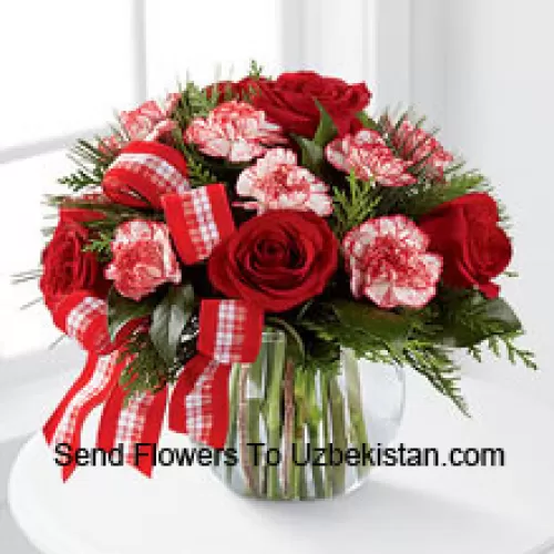 Send warm wishes and bright sentiments for a wonderful holiday season! Rich red roses and peppermint carnations are delicately arranged with holiday greens to create a festive display. Arriving in a clear glass bubble bowl and accented with a red and white plaid ribbon, this arrangement is full of seasonal sophistication. (Please Note That We Reserve The Right To Substitute Any Product With A Suitable Product Of Equal Value In Case Of Non-Availability Of A Certain Product)