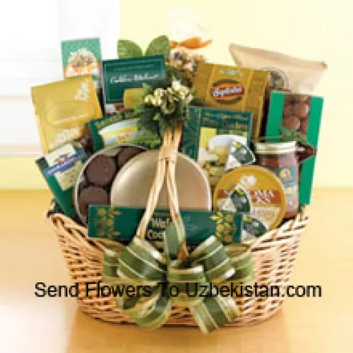 Start a tradition of sending good taste to everyone on your holiday gift list this year. Our classic wicker basket comes piled high with a gourmet assortment that is sure to please. Whether you need something to send to corporate clients or your favorite aunt and uncle, this gift basket is up to the job. We accent the basket with green and gold ribbon and holiday accents to make a great impression. Inside your recipients will discover an assortment that features something for everyone: Lindt chocolate truffles, smoked almonds, walnut cookies, chocolate cookies, chocolate-covered popcorn, cheese, crackers, a Ghirardelli chocolate bar, tortilla chips, salsa, chocolate wafer cookies , cheese swirls, and chocolate-covered sandwich cookies. (Please Note That We Reserve The Right To Substitute Any Product With A Suitable Product Of Equal Value In Case Of Non-Availability Of A Certain Product)